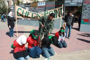Anti-Israel activists at UCLA set up a mock checkpoint and spread baseless lies about the IDF (photo credit: AMCHA Initiative).